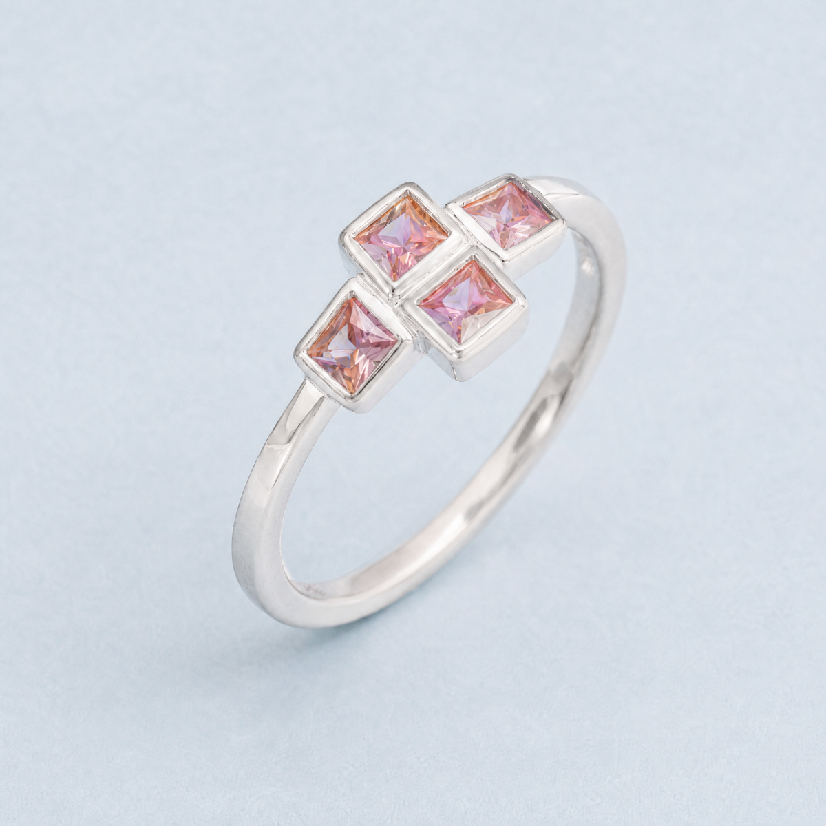 Petite Four Stone Cross Ring in 925 sterling silver, angled view