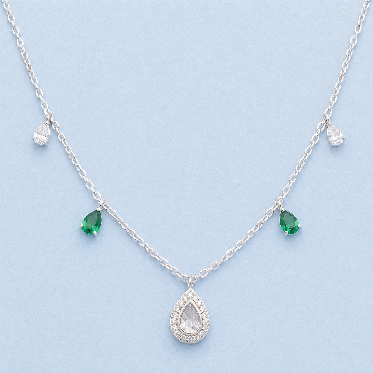 Green Accent Pear Halo Necklace in 925 sterling silver, front view