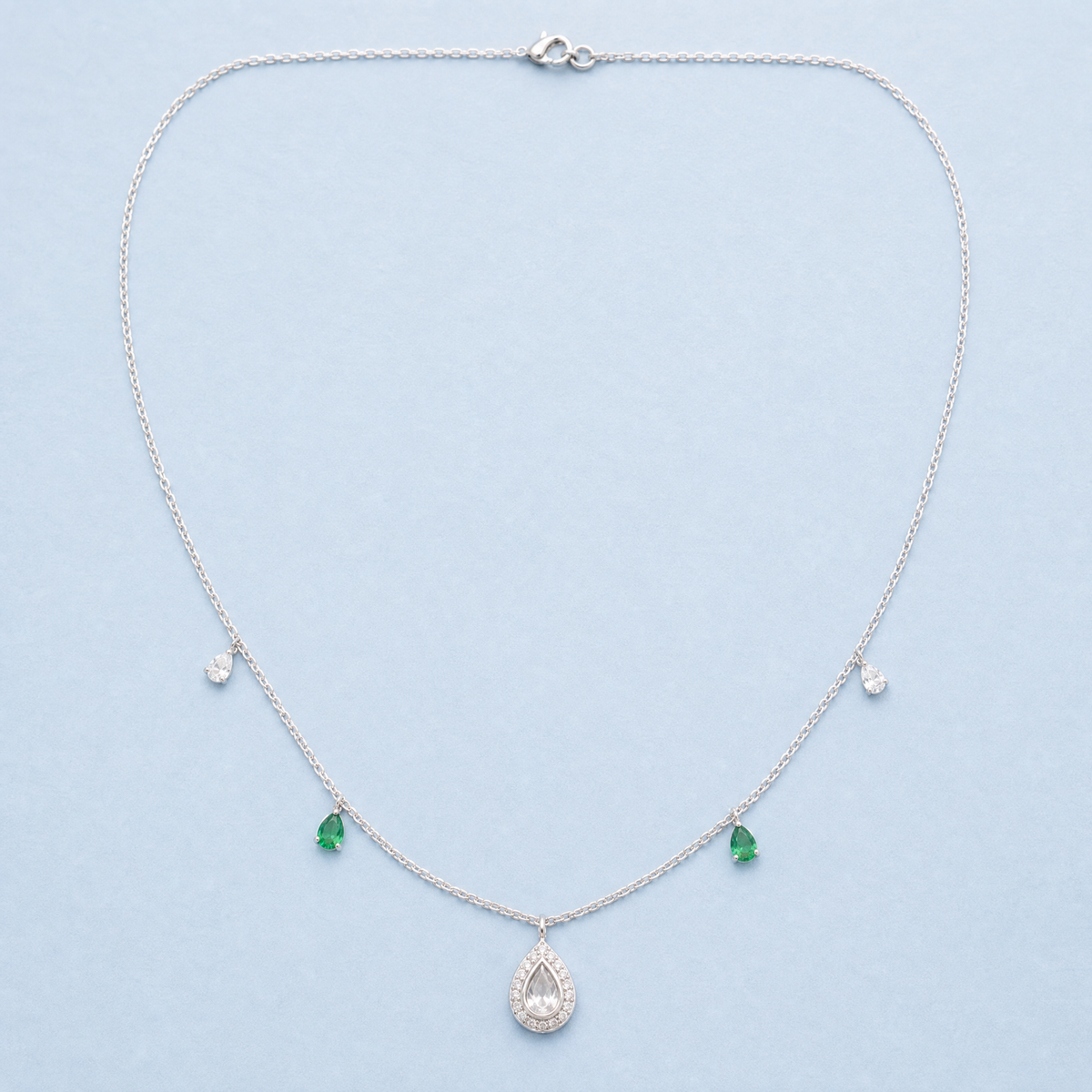 Green Accent Pear Halo Necklace in 925 sterling silver, full necklace laid flat