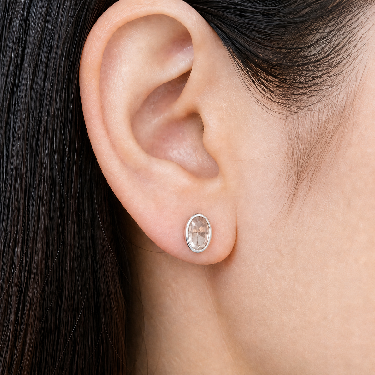 Blush Oval Bezel Stud Earrings in 925 sterling silver, worn on the ear