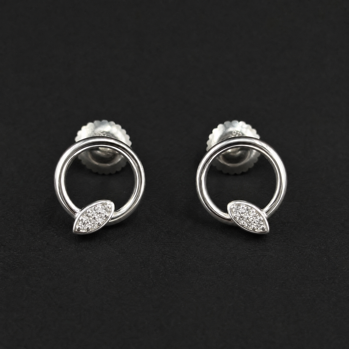 Leaf Sparkle Circle Stud Earrings in 925 sterling silver, on a dark background