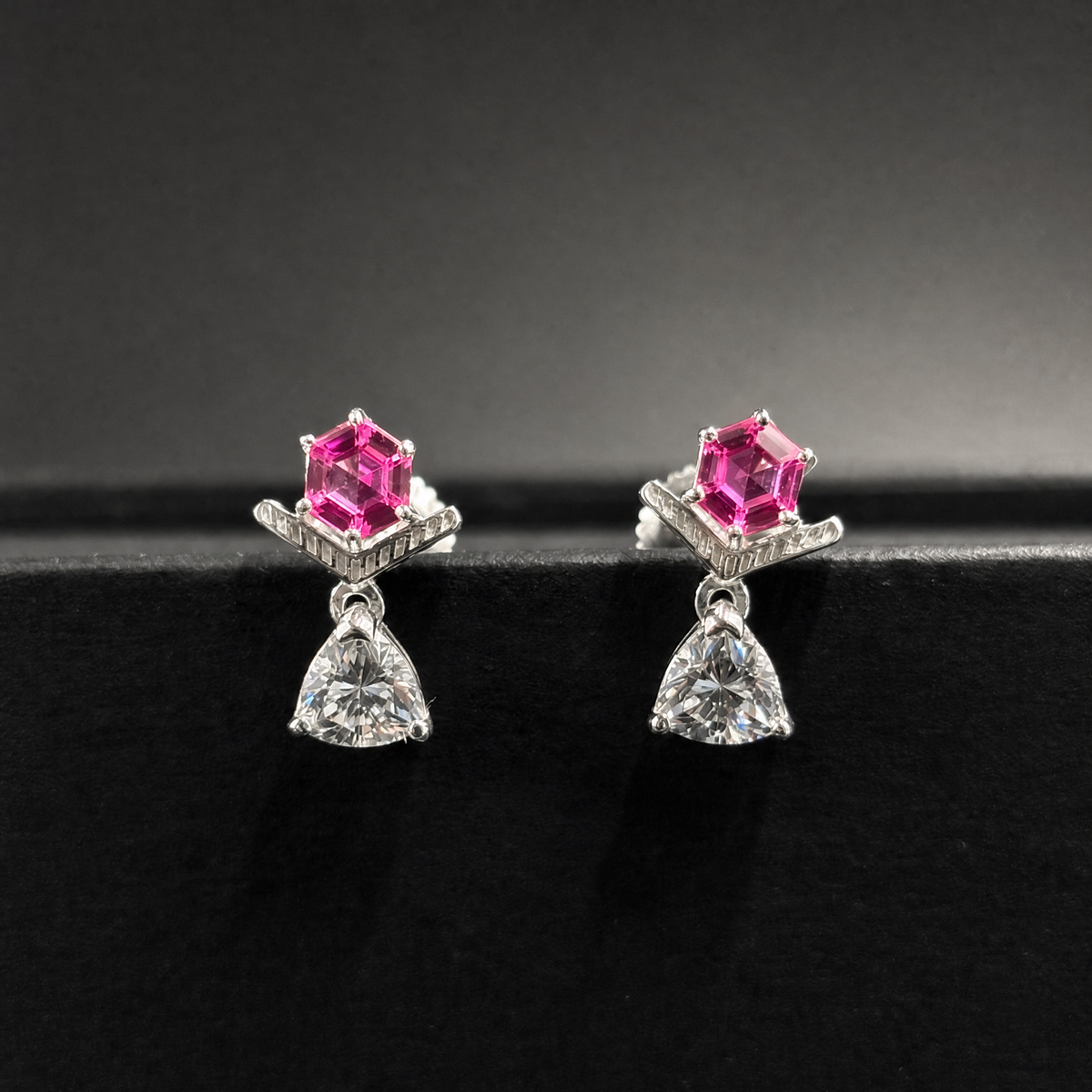 Pink Hexagon Chevron Drop Earrings in 925 sterling silver, on a dark background