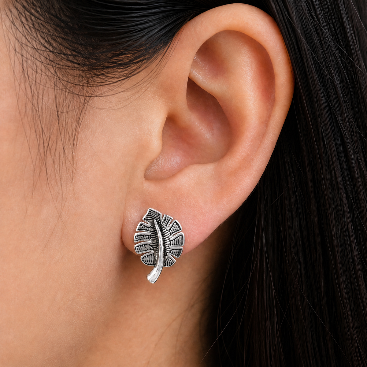 Textured Leaf Stud Earrings in 925 sterling silver, worn on the ear