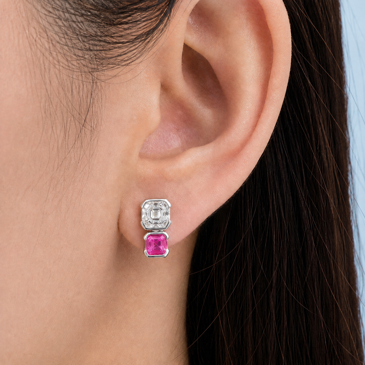 Stacked Clear and Pink Stud Earrings in 925 sterling silver, worn on the ear