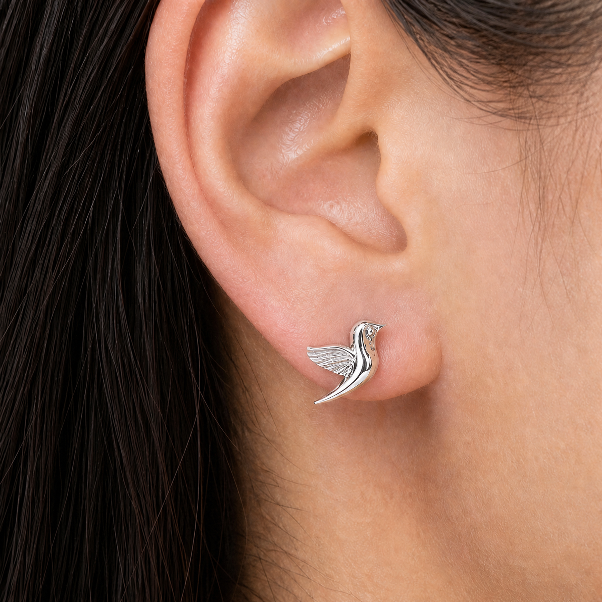 Songbird Stud Earrings in 925 sterling silver, worn on the ear