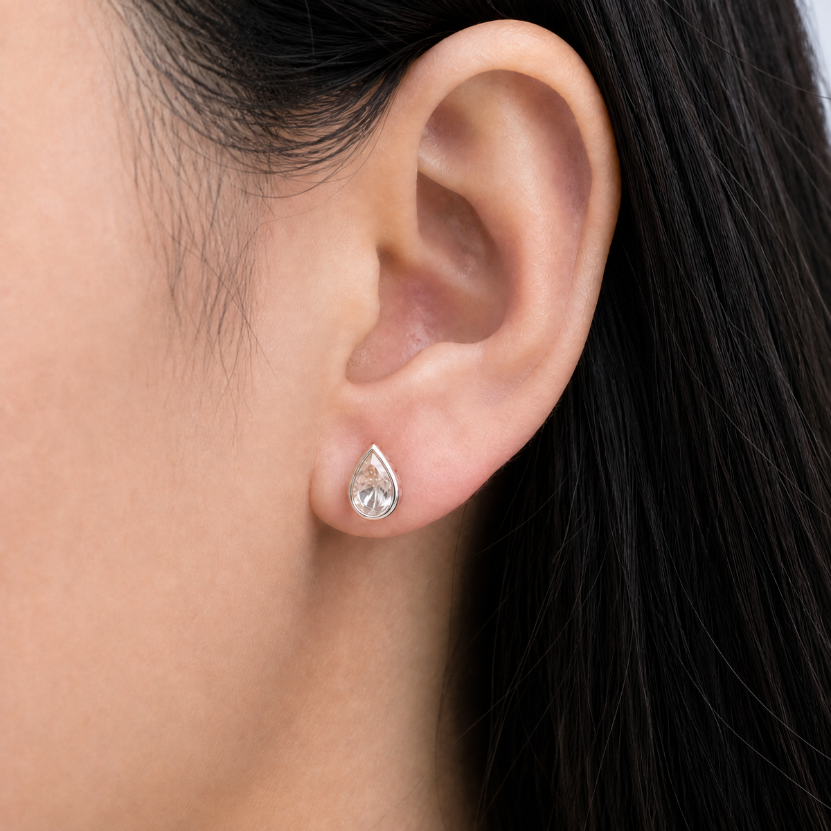 Blush Pear Bezel Stud Earrings in 925 sterling silver, worn on the ear