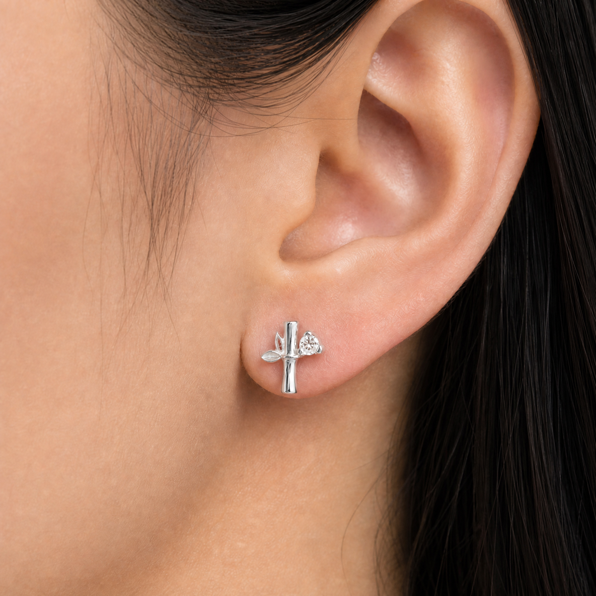 Bamboo Leaf Stud Earrings in 925 sterling silver, worn on the ear