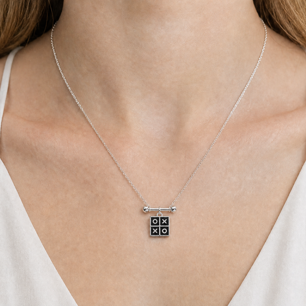 Tic Tac Toe Pendant Necklace in 925 sterling silver, worn at the neckline