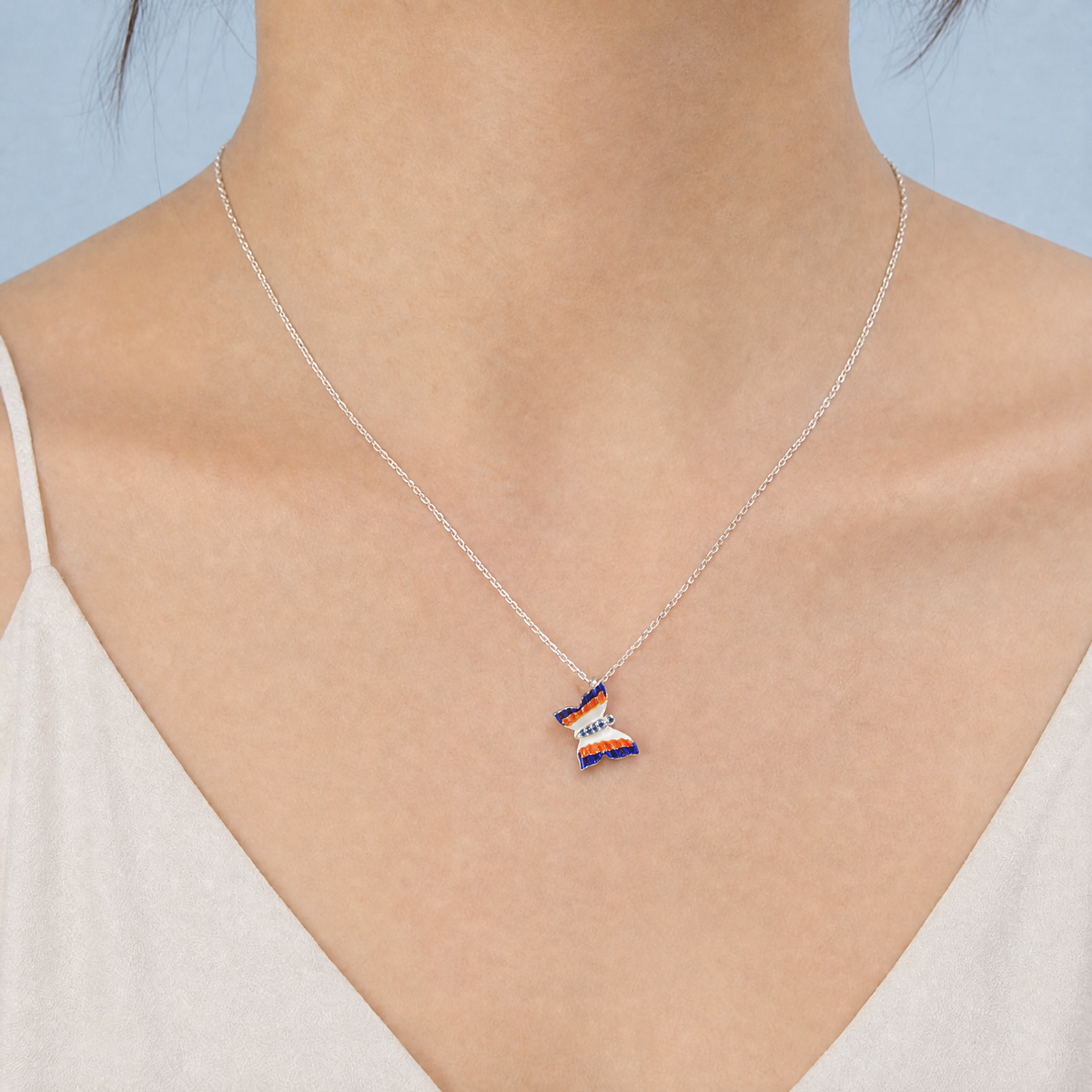 Striped Butterfly Enamel Necklace in 925 sterling silver, worn at the neckline