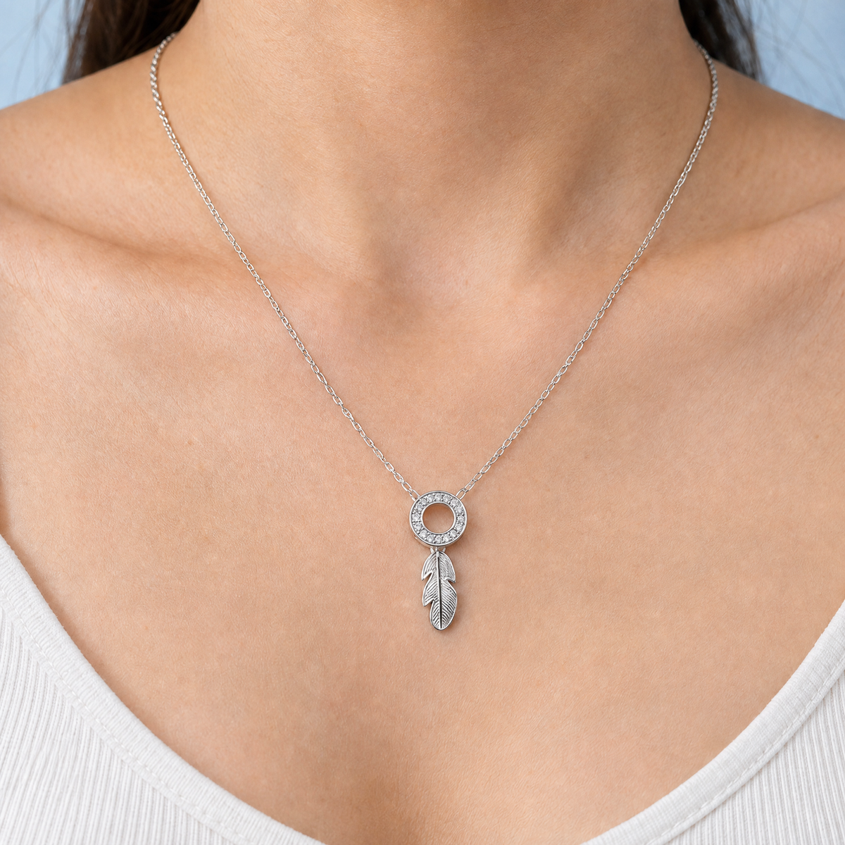 Feather Circle Pendant Necklace in 925 sterling silver, worn at the neckline