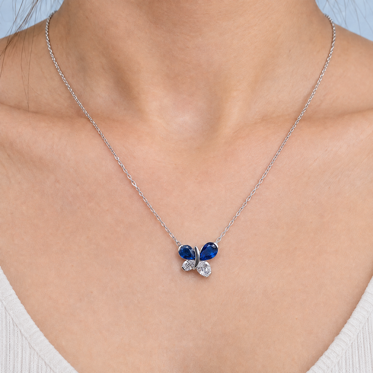 Blue Wing Butterfly Necklace in 925 sterling silver, worn at the neckline