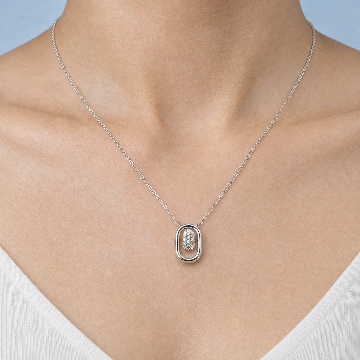 Oval Frame Cluster Necklace in 925 sterling silver, worn at the neckline
