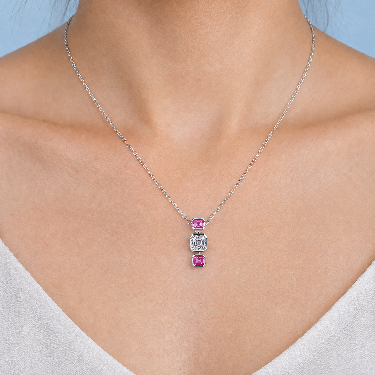Pink and Clear Trio Necklace in 925 sterling silver, worn at the neckline
