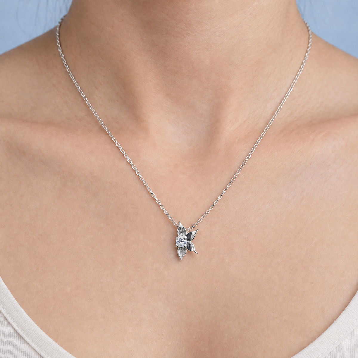 Petal Bloom Pendant Necklace in 925 sterling silver, worn at the neckline