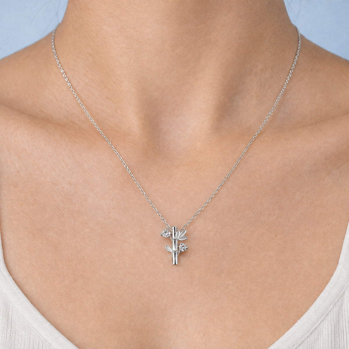 Bamboo Leaf Pendant Necklace in 925 sterling silver, worn at the neckline