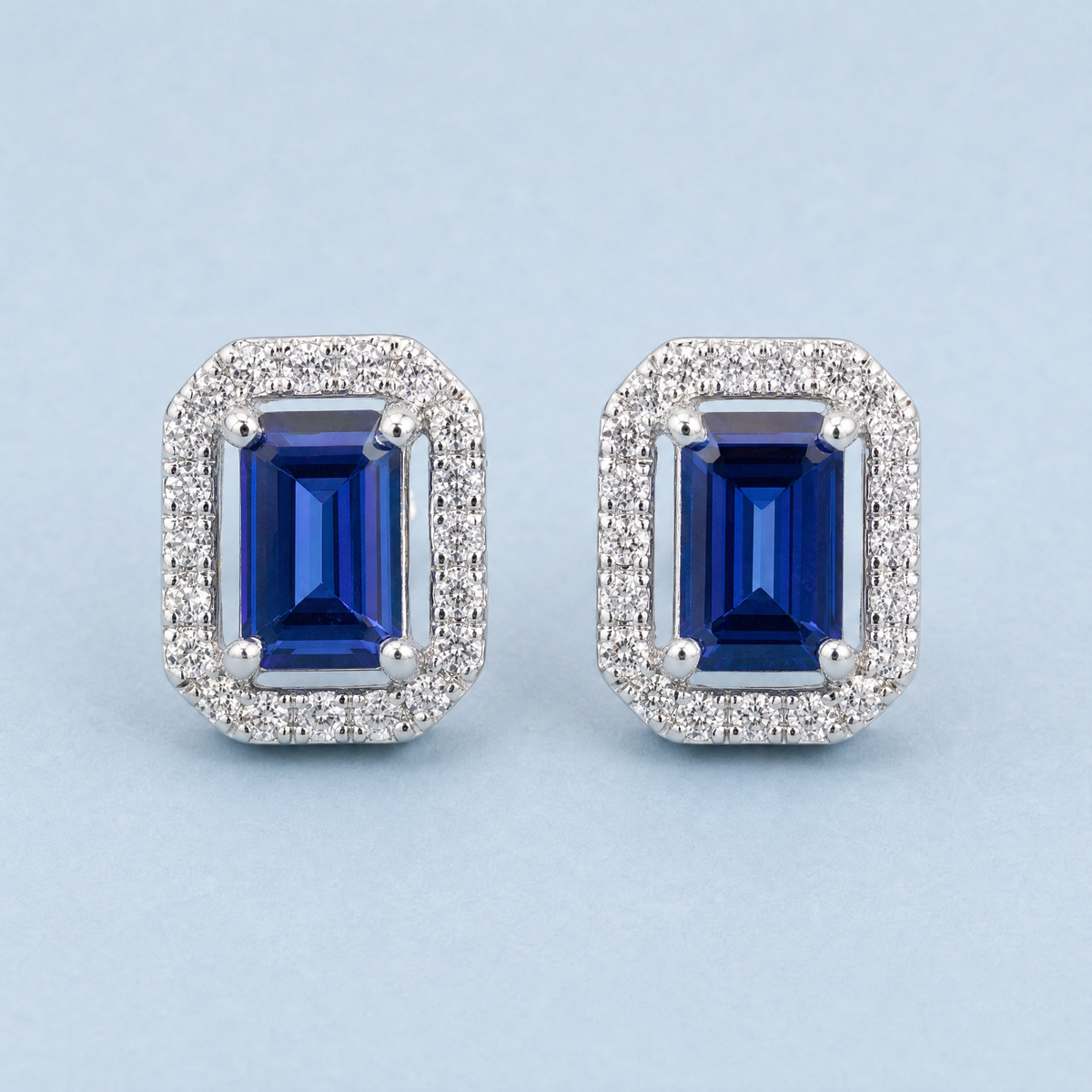 Blue Step Cut Halo Stud Earrings in 925 sterling silver, close front view