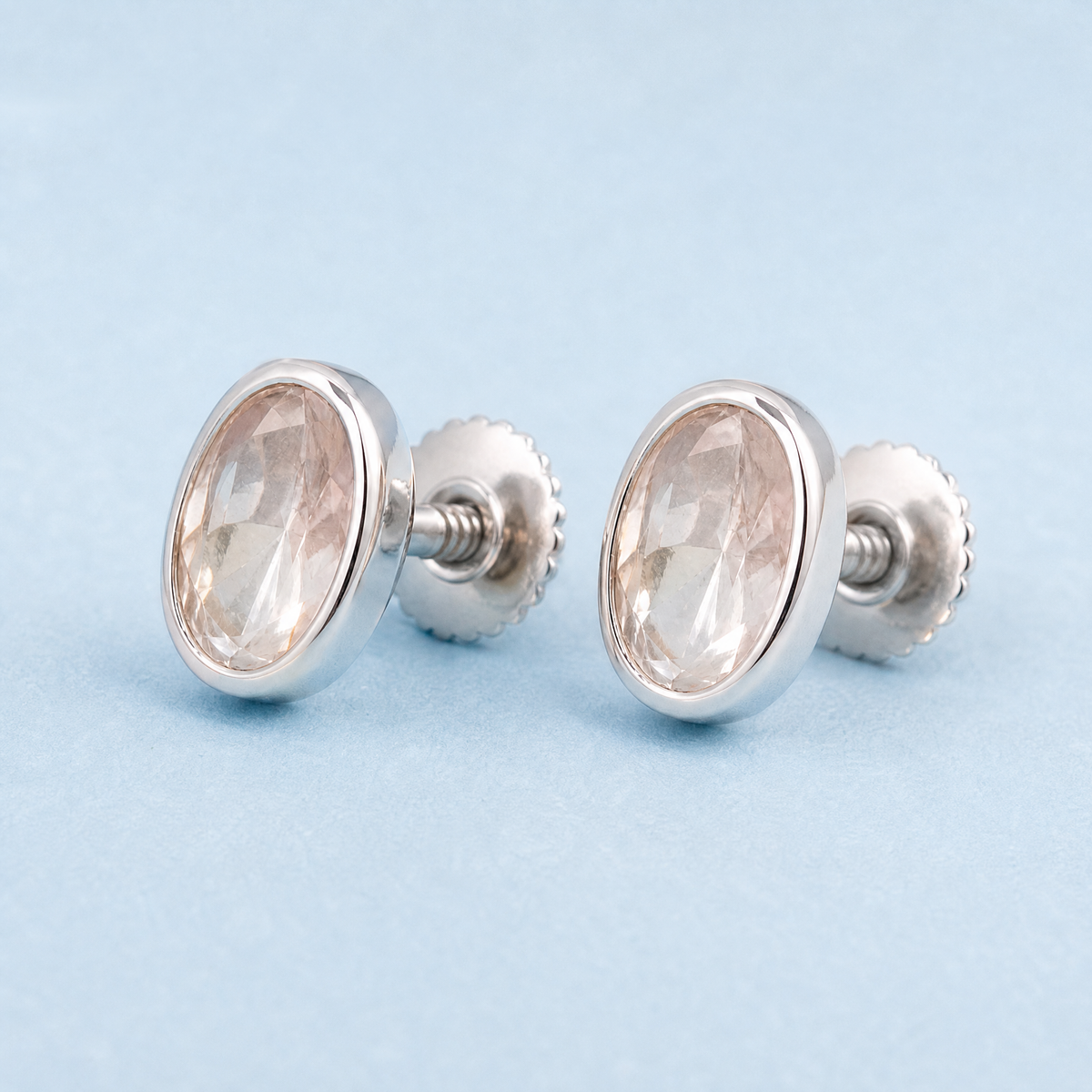 Blush Oval Bezel Stud Earrings in 925 sterling silver, angled view