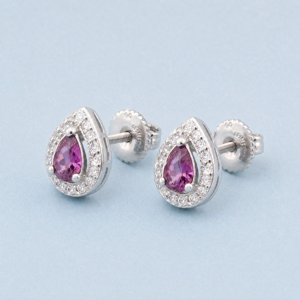 Purple Pear Halo Stud Earrings in 925 sterling silver, angled view