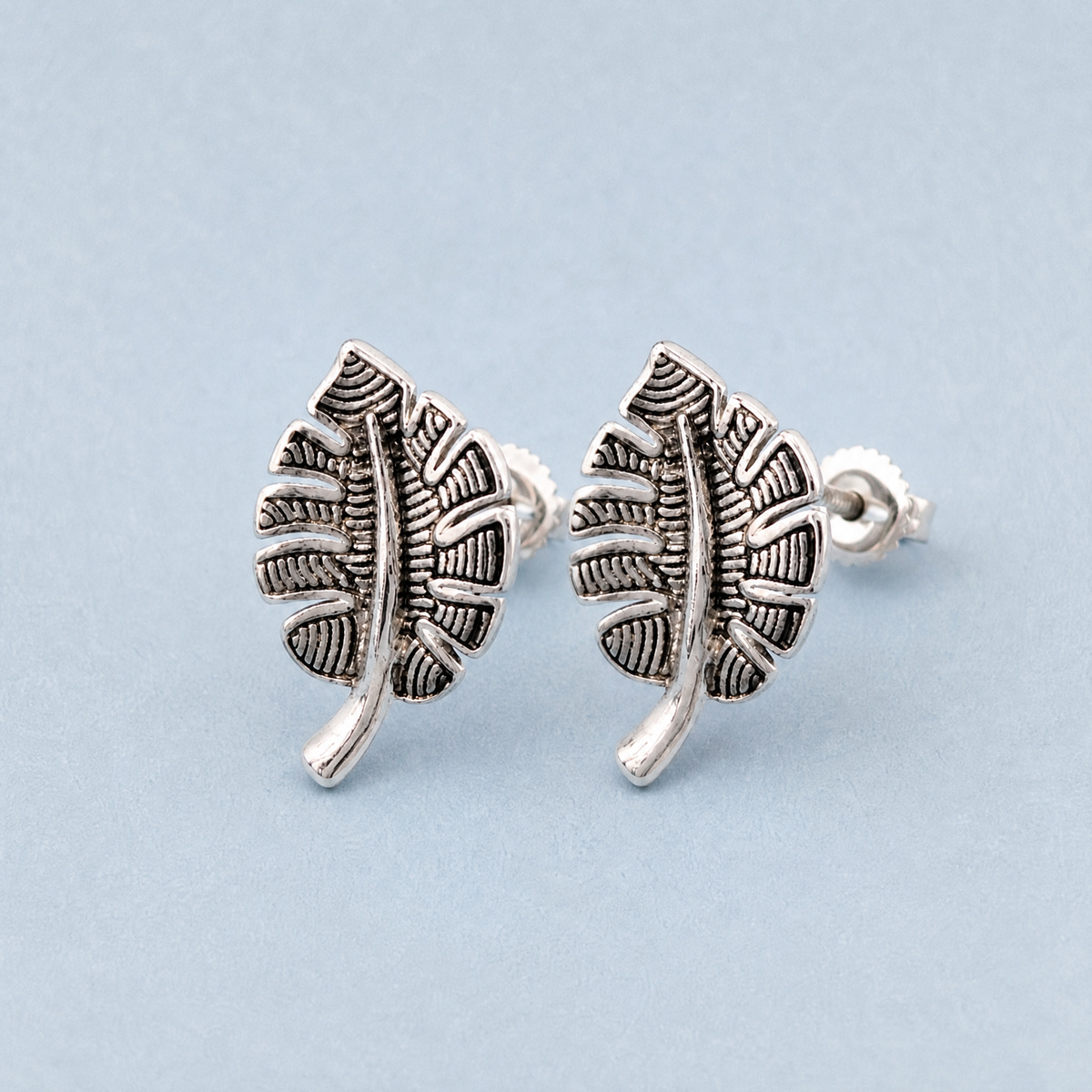 Textured Leaf Stud Earrings in 925 sterling silver, angled view