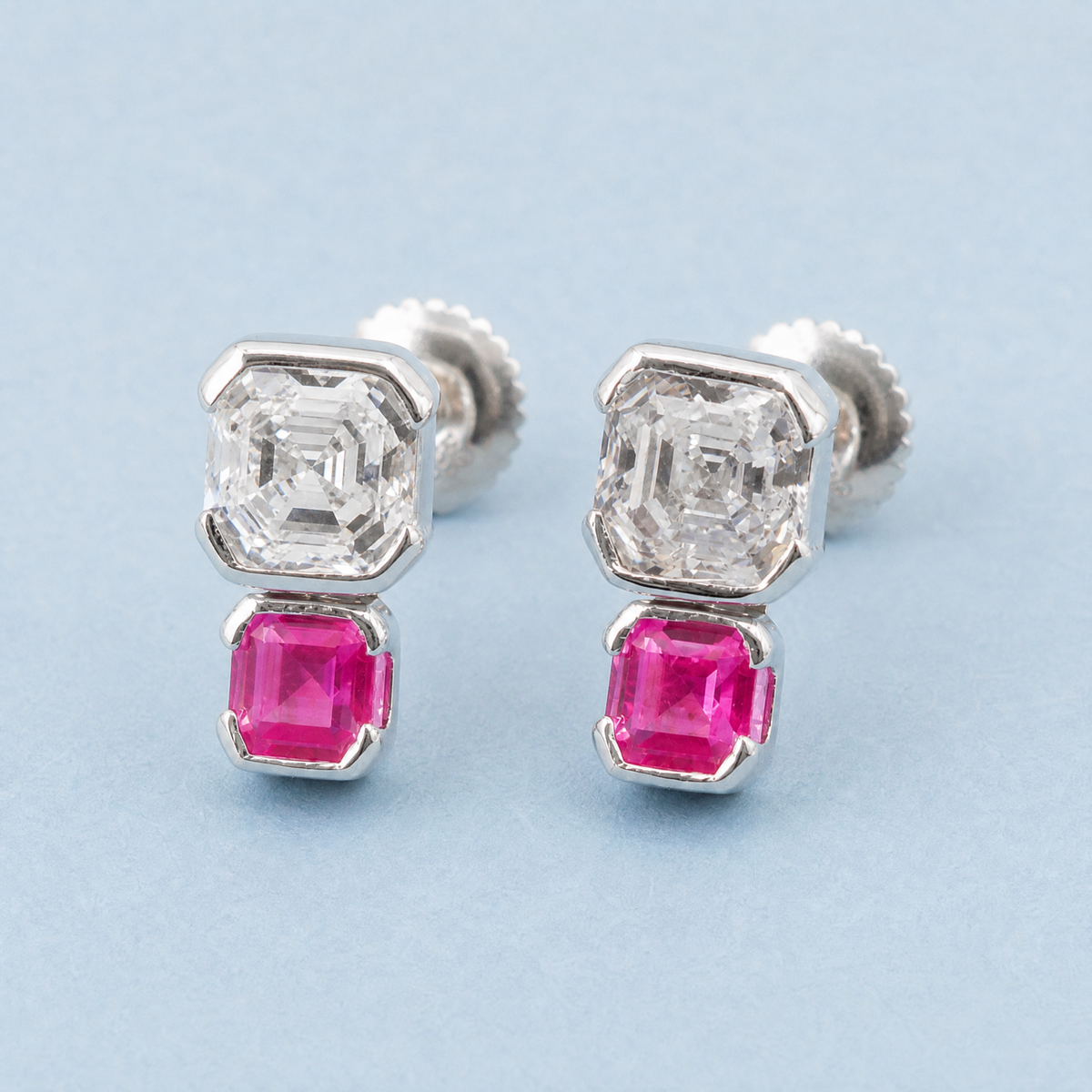 Stacked Clear and Pink Stud Earrings in 925 sterling silver, angled view