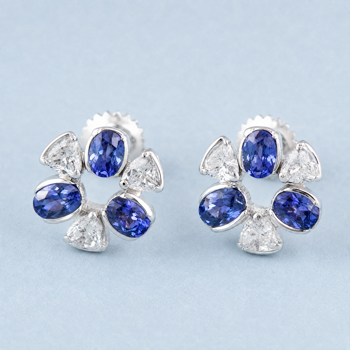 Blue and Clear Flower Stud Earrings in 925 sterling silver, angled view