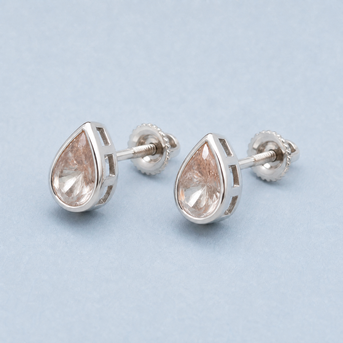 Blush Pear Bezel Stud Earrings in 925 sterling silver, angled view