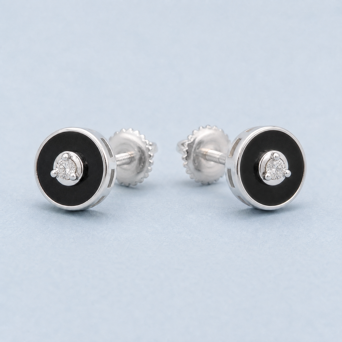 Black Enamel Disc Stud Earrings in 925 sterling silver, angled view