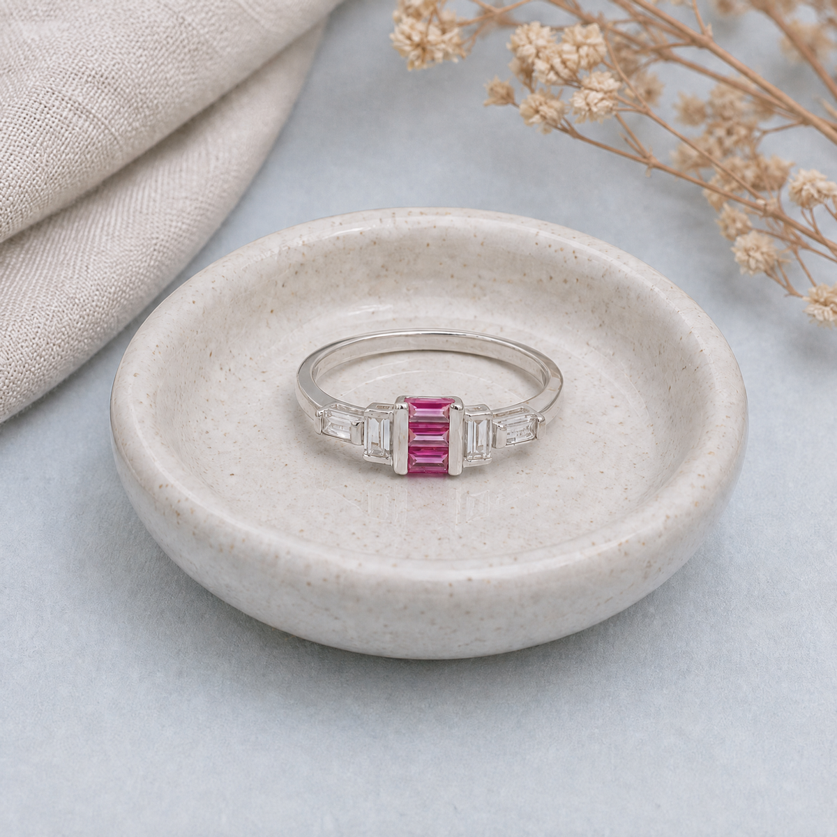 Pink Baguette Step Ring in 925 sterling silver, in a ceramic dish