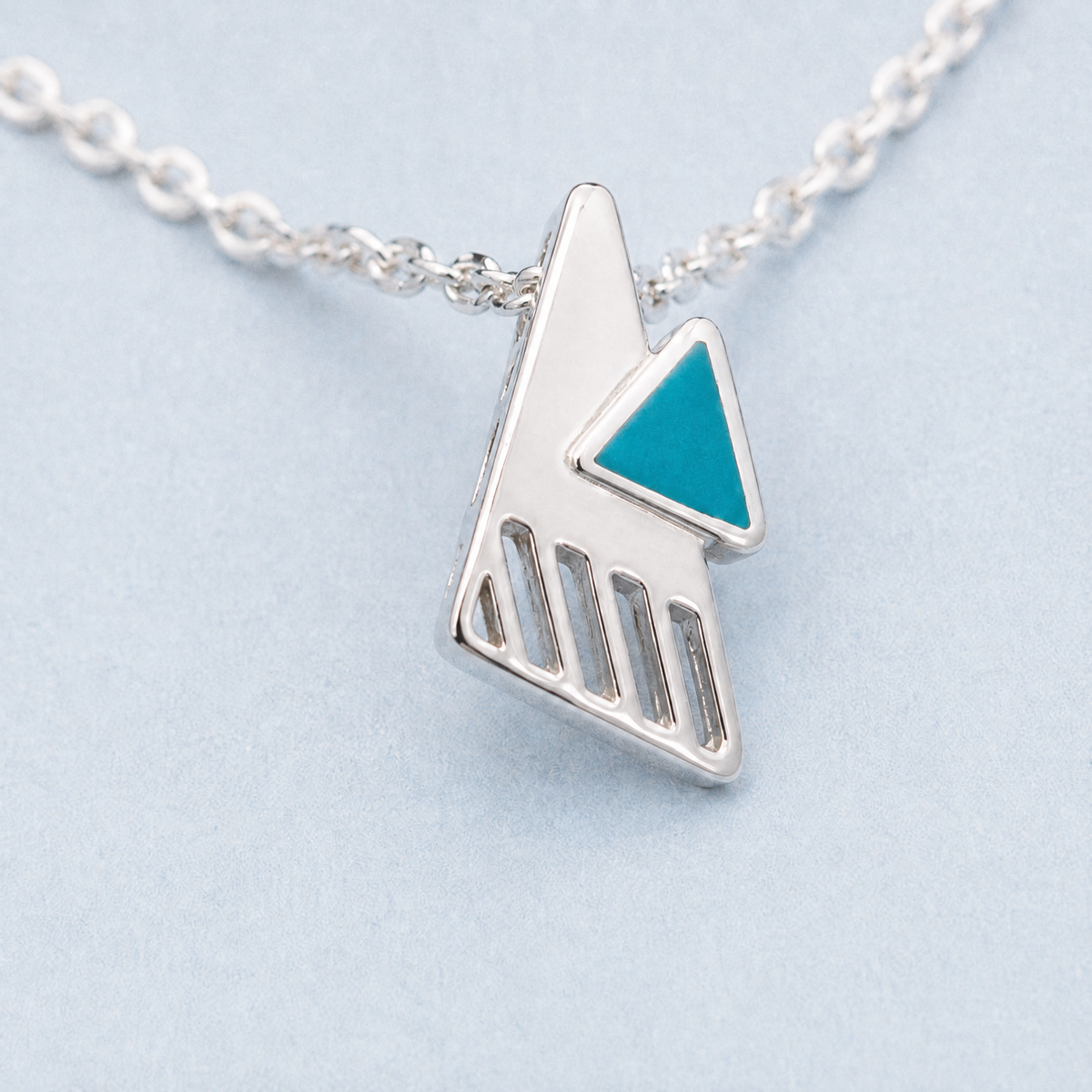 Teal Triangle Enamel Pendant Necklace in 925 sterling silver, close-up of the pendant