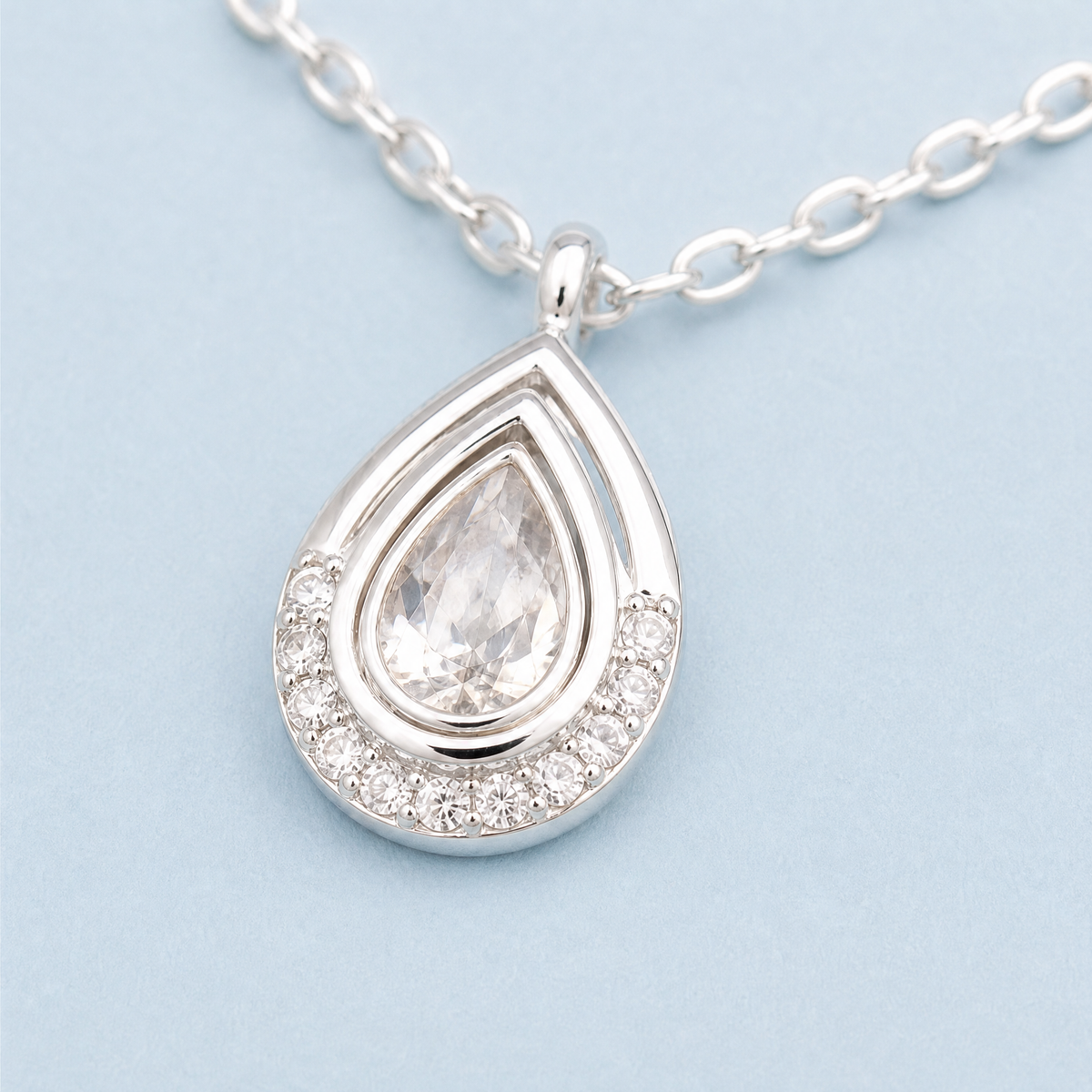 Pear Halo Station Necklace in 925 sterling silver, close-up of the pendant