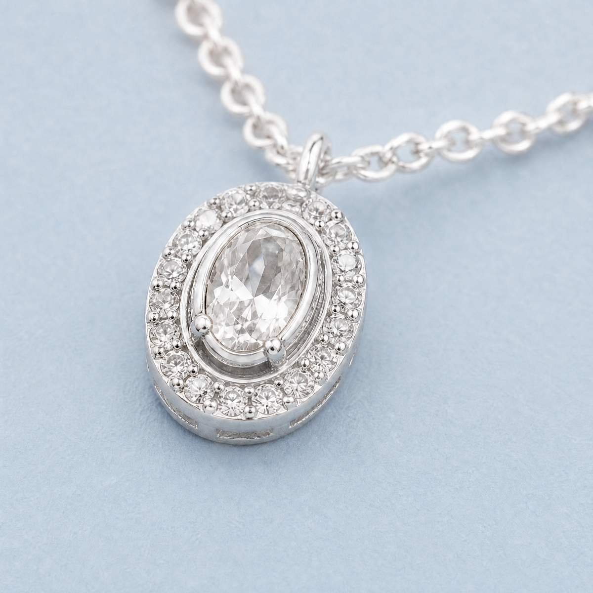 Oval Halo Station Necklace in 925 sterling silver, close-up of the pendant