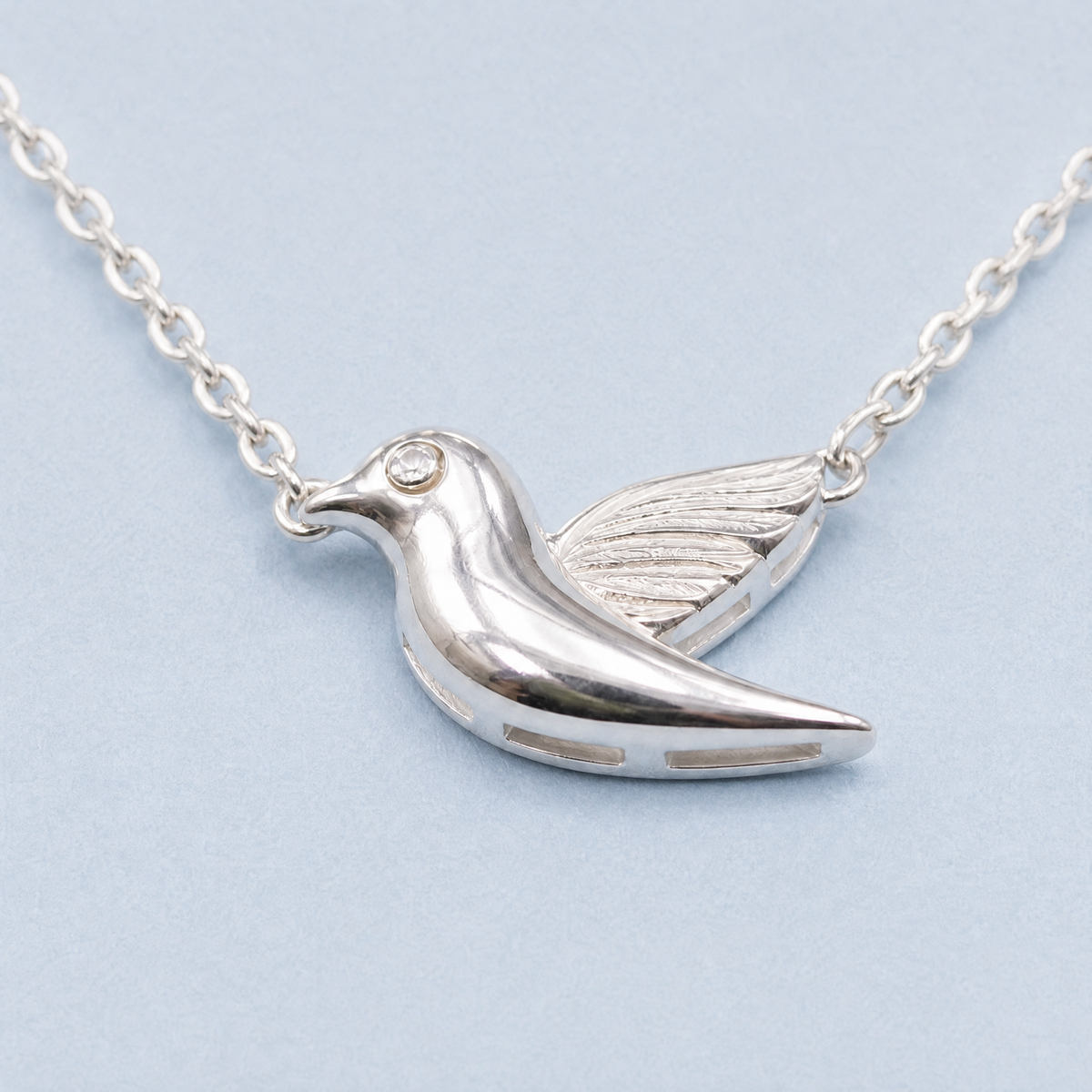 Songbird Pendant Necklace in 925 sterling silver, close-up of the pendant