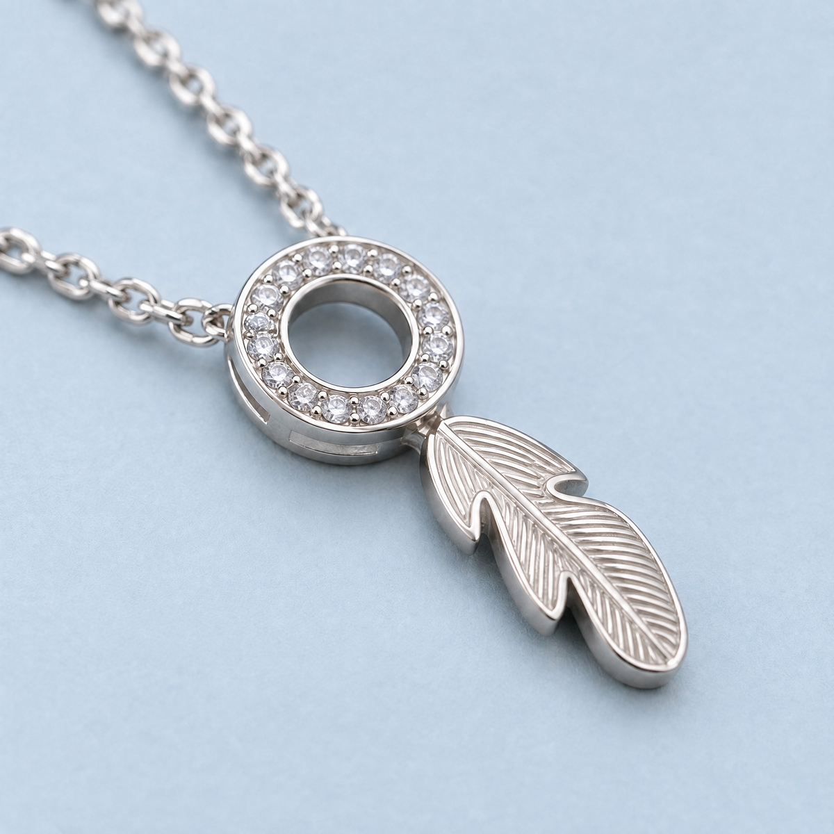Feather Circle Pendant Necklace in 925 sterling silver, close-up of the pendant