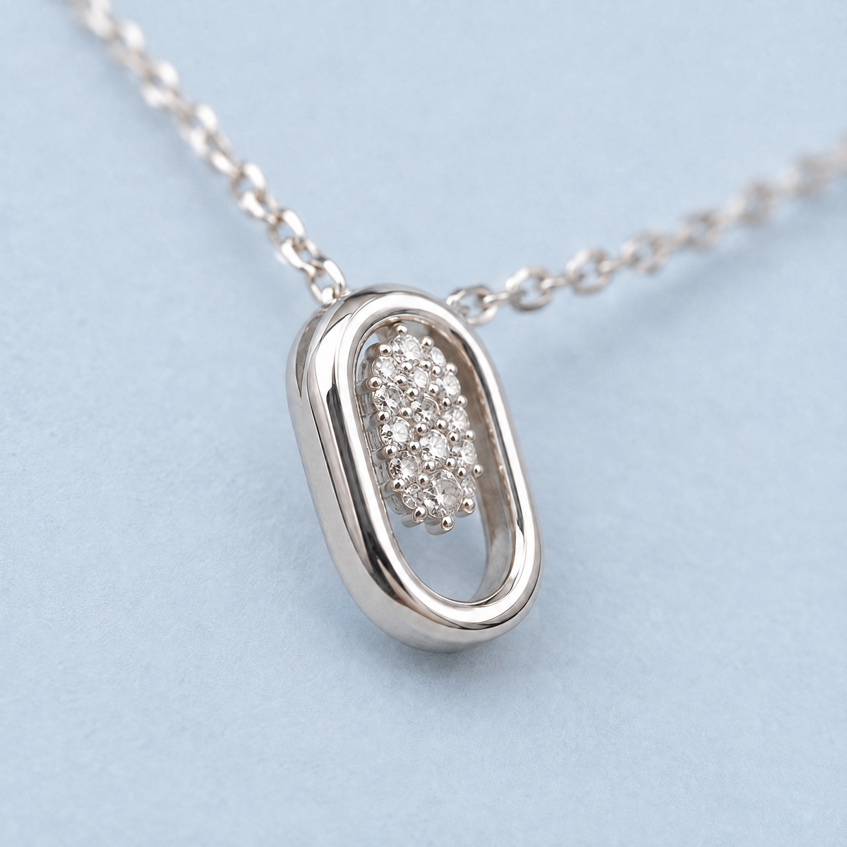 Oval Frame Cluster Necklace in 925 sterling silver, close-up of the pendant