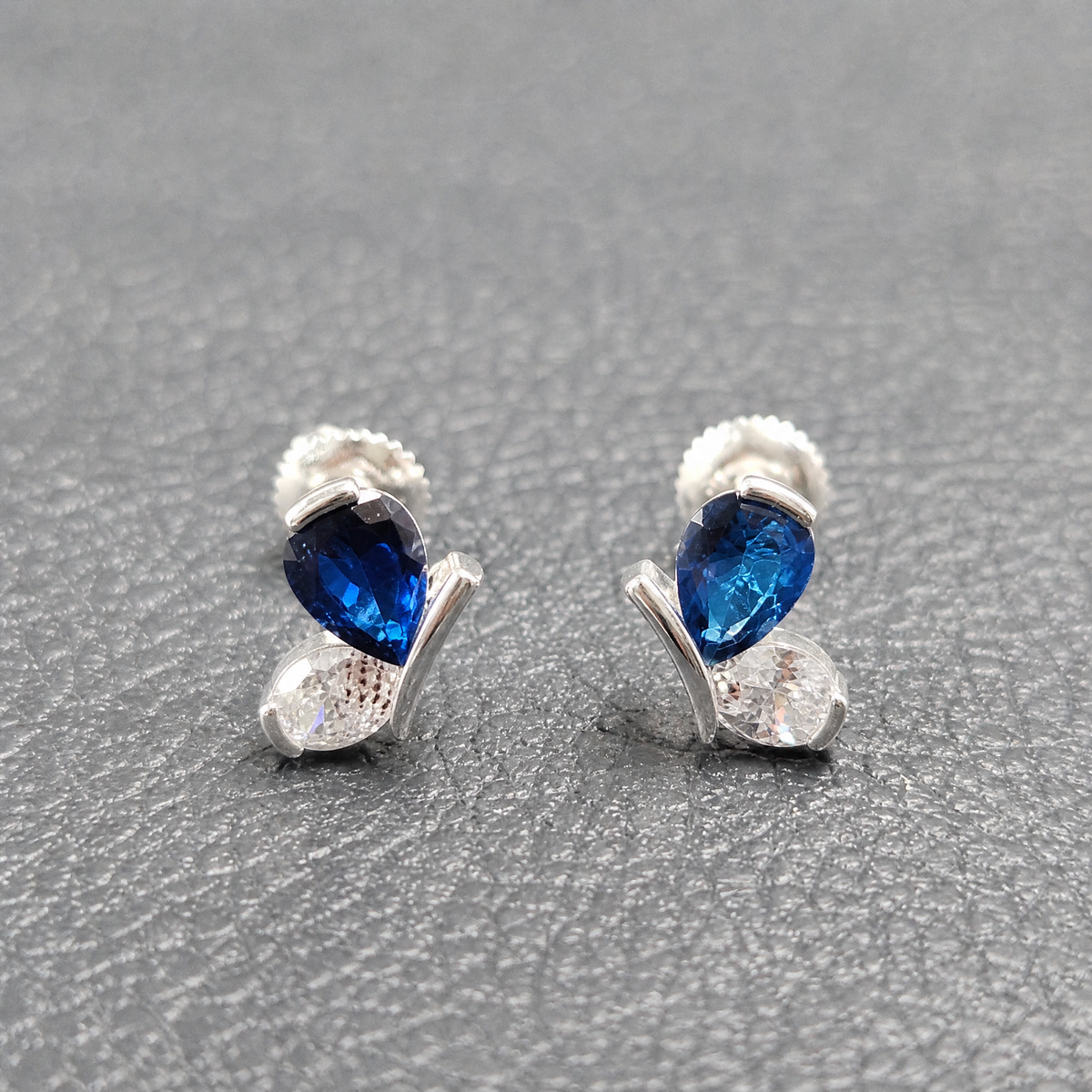 Blue Wing Butterfly Stud Earrings in 925 sterling silver, angled view on a dark background
