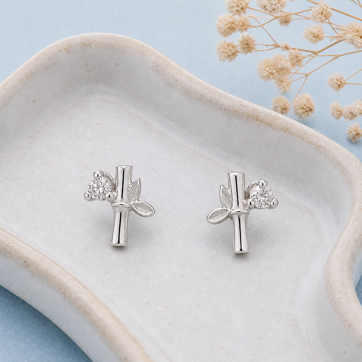 Bamboo Leaf Stud Earrings in 925 sterling silver, on a ceramic dish