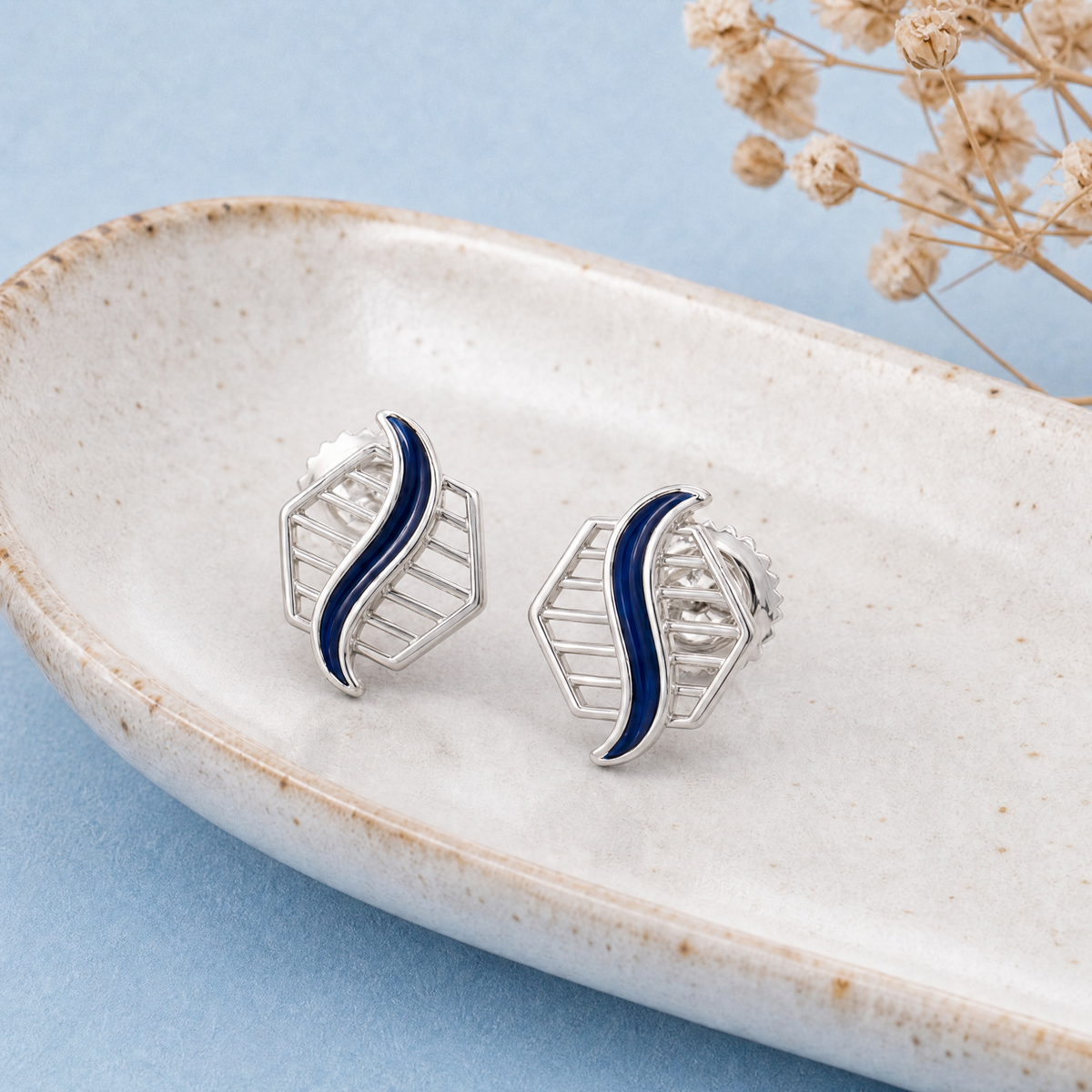 Blue Wave Enamel Stud Earrings in 925 sterling silver, on a ceramic dish