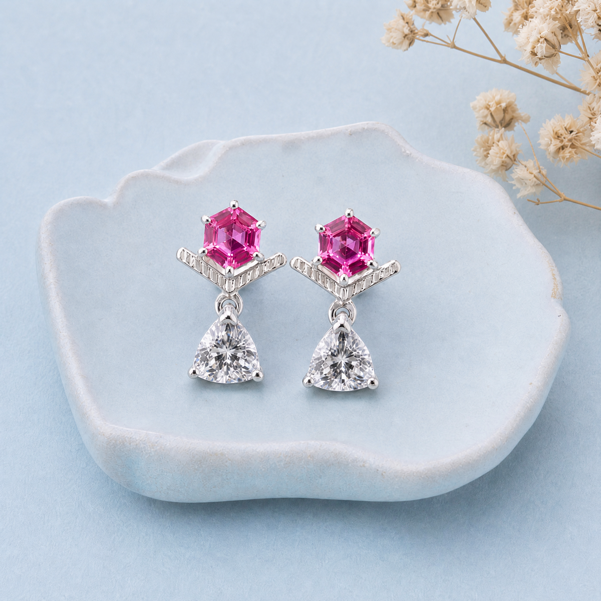 Pink Hexagon Chevron Drop Earrings in 925 sterling silver, on a ceramic dish