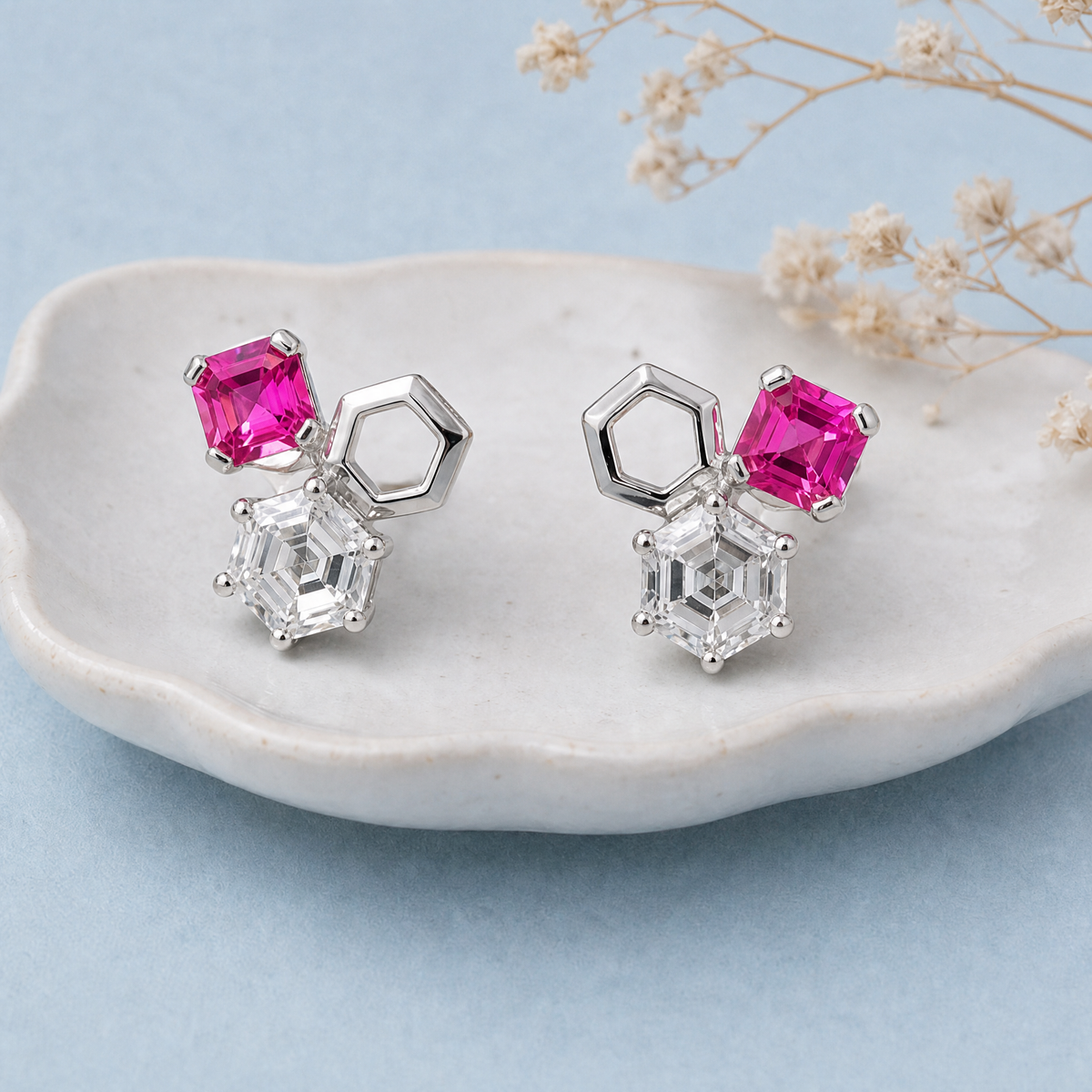 Hexagon Trio Cluster Stud Earrings in 925 sterling silver, on a ceramic dish
