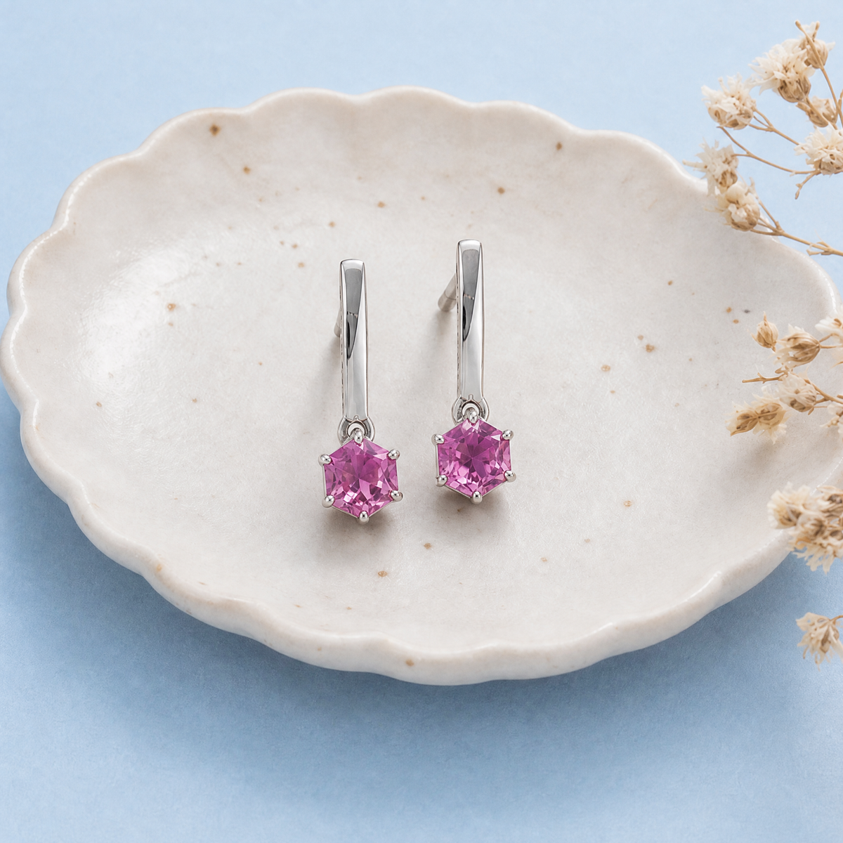 Pink Hexagon Bar Drop Earrings in 925 sterling silver, on a ceramic dish