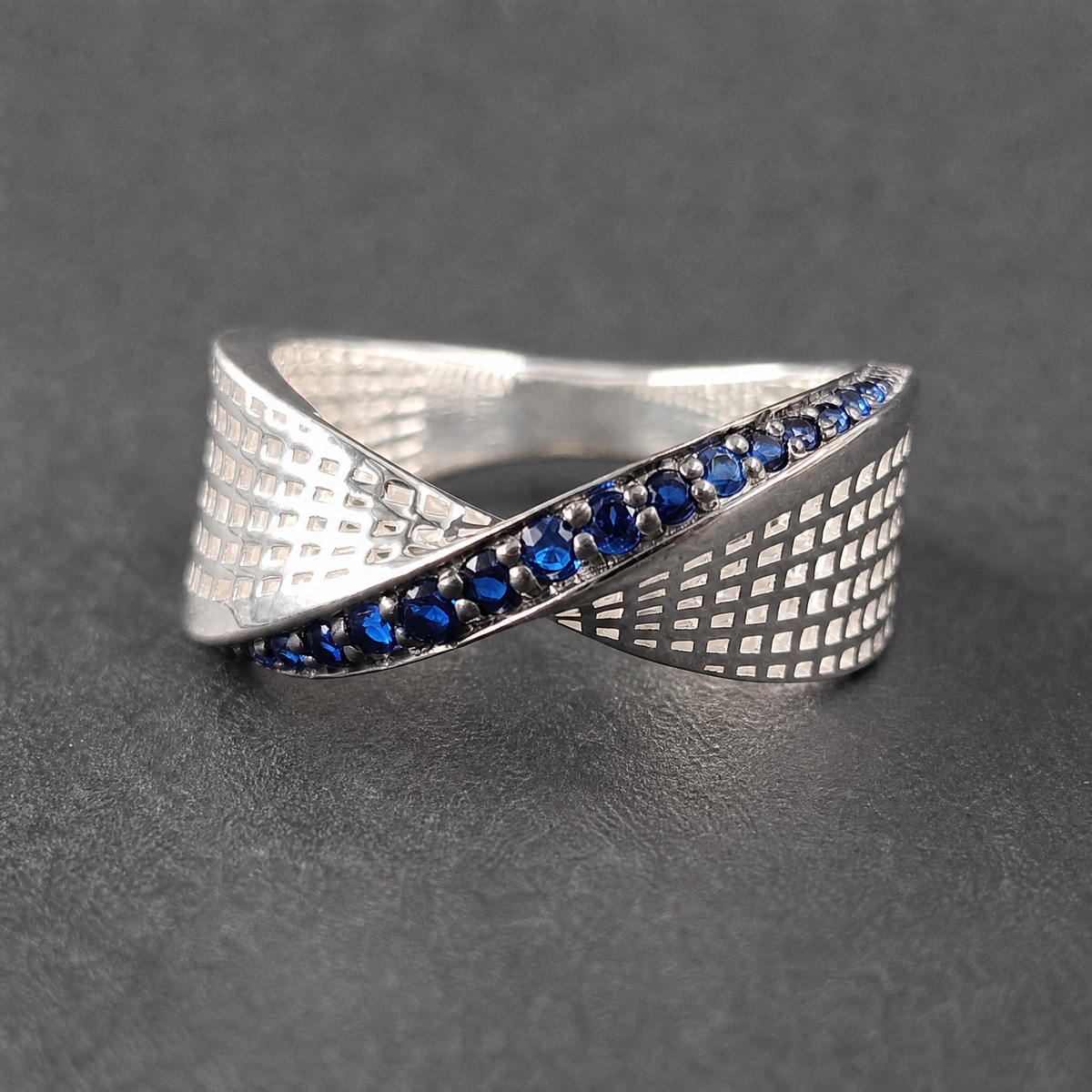 Blue Twist Lattice Band Ring in 925 sterling silver, on a dark background