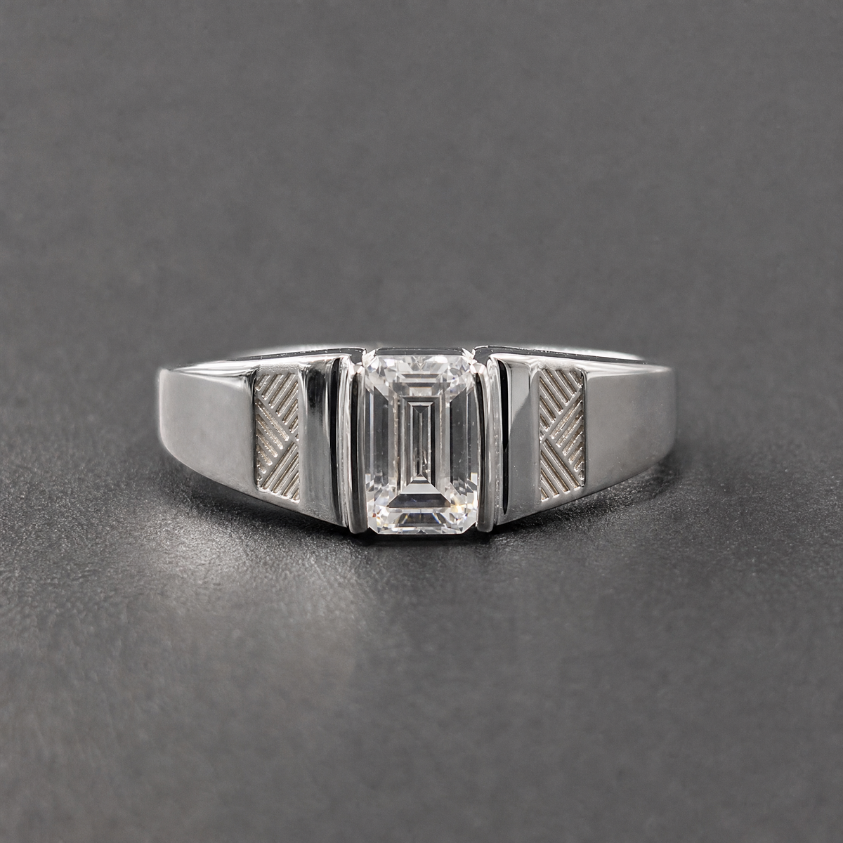 Engraved Panel Step Cut Ring in 925 sterling silver, on a dark background