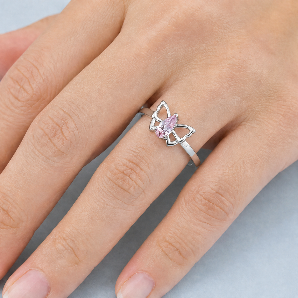 Pink Butterfly Outline Ring in 925 sterling silver, worn on the hand